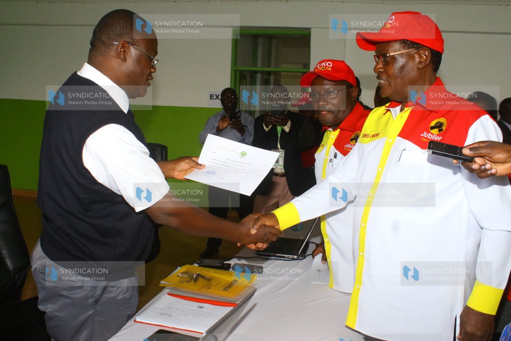 Kisii governorship aspirant Chris Obure (Right) and his deputy Eng. Albert Nyaundi (left) addressing their supporters