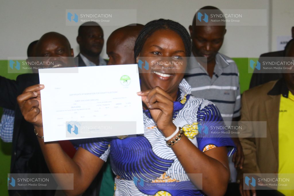 Jubilee Party Donya Dorice Aburi displays her nomination certificate