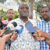 Energy Cabinet Secretary Charles Keter (C) addresses the media