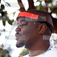 Waithaka MCA Anthony Karanja puts on locally made Personal Protective Equipment (PPE) by Fadscape ventures