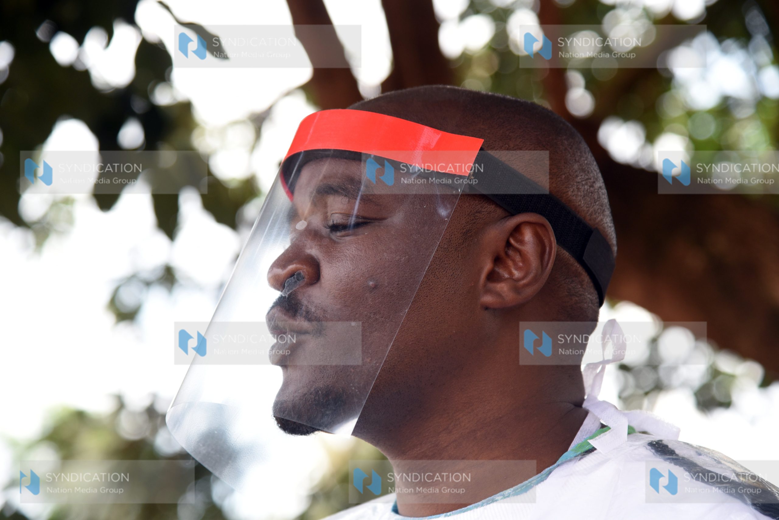 Waithaka MCA Anthony Karanja puts on locally made Personal Protective Equipment (PPE) by Fadscape ventures