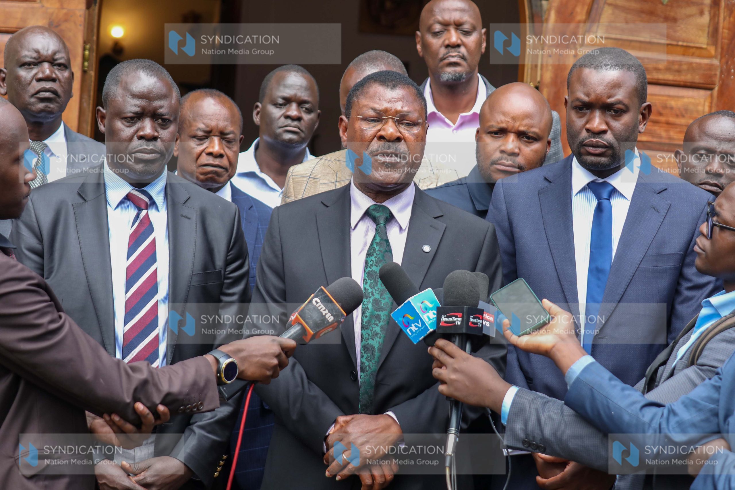 Addressing the media at the Lee Funeral Home Services