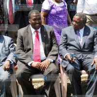 Labor minister John Munyes (left) talks to COTU Secretary General Francis Atwoli (right) during a workshop for trade unionists