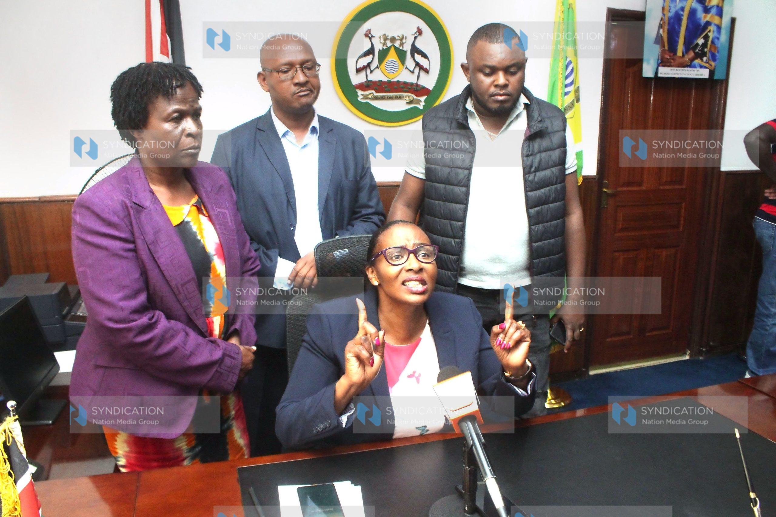 (Center) Nairobi Speaker Beatrice Elachi speaking to the press surrounded by her supporters