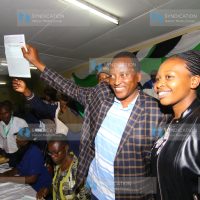 Ford Kenya party candidate and MP-elect Richard Onyonka and his wife Gesare Onyonka (in black jacket) display his winning certificate