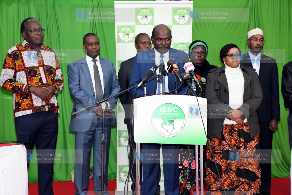 Independent Electoral and Boundaries Commission (IEBC) Chairman Wafula Chebukati (center, podium) briefs media