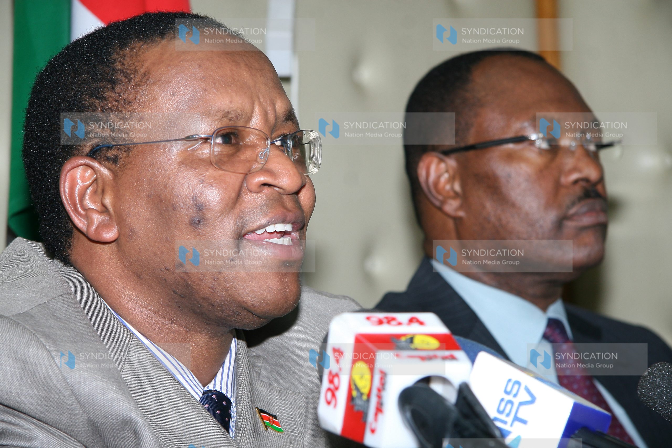 Principal secretary Karanja Kibicho (left) flanked by Political and diplomatic secretary Amb. Robert Ngesu addresses a media