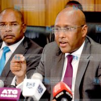 Acting Agriculture Cabinet Secretary Adan Mohamed (right) speaks during a media briefing