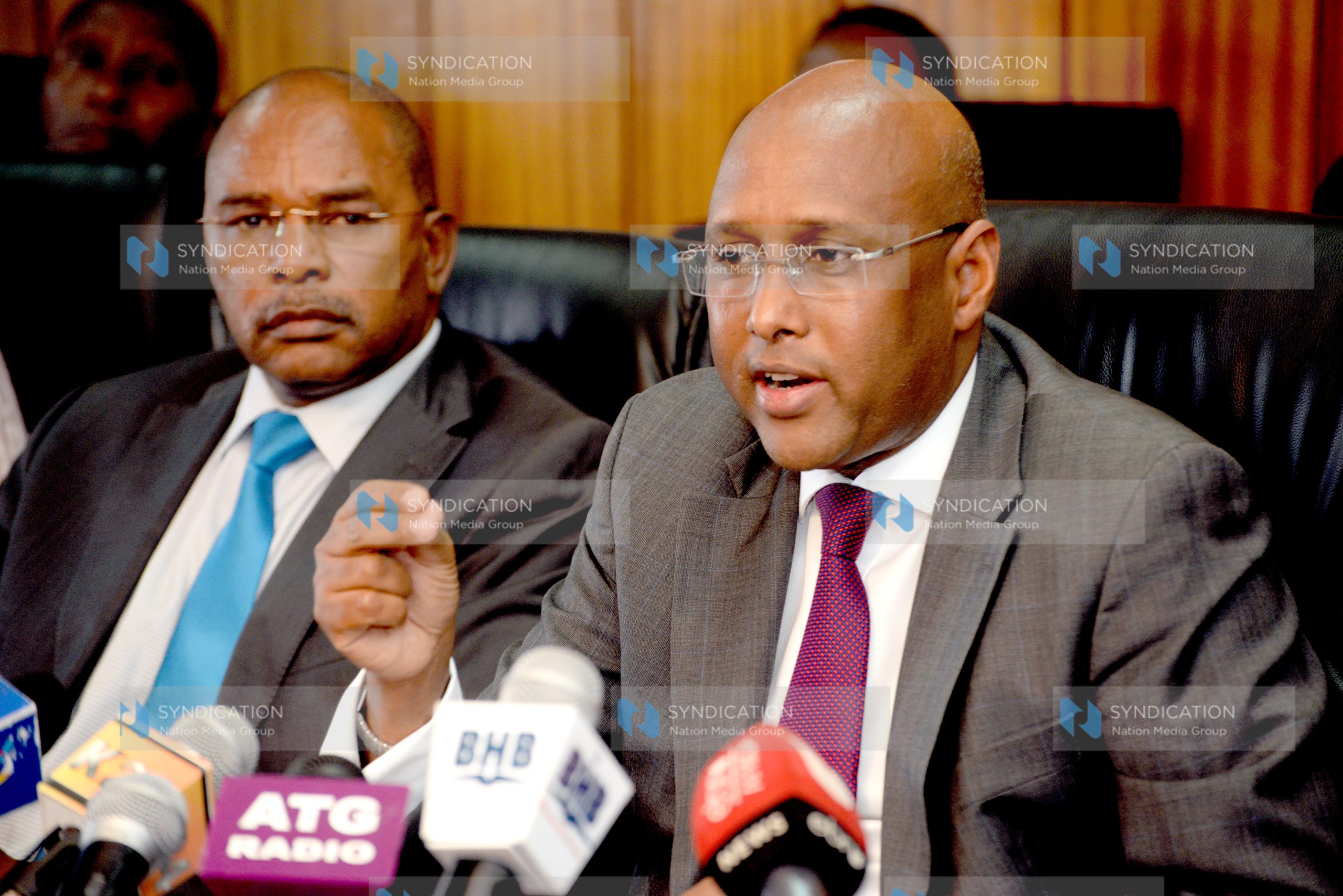 Acting Agriculture Cabinet Secretary Adan Mohamed (right) speaks during a media briefing