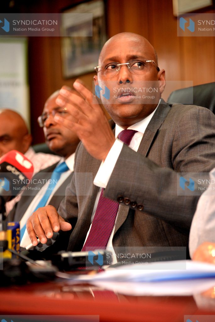 Acting Agriculture Cabinet Secretary Adan Mohamed (right) speaks during a media briefing