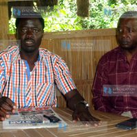 Homa Bay Town MP Peter Opondo Kaluma flanked by County ODM Treasurer addressing a press conference