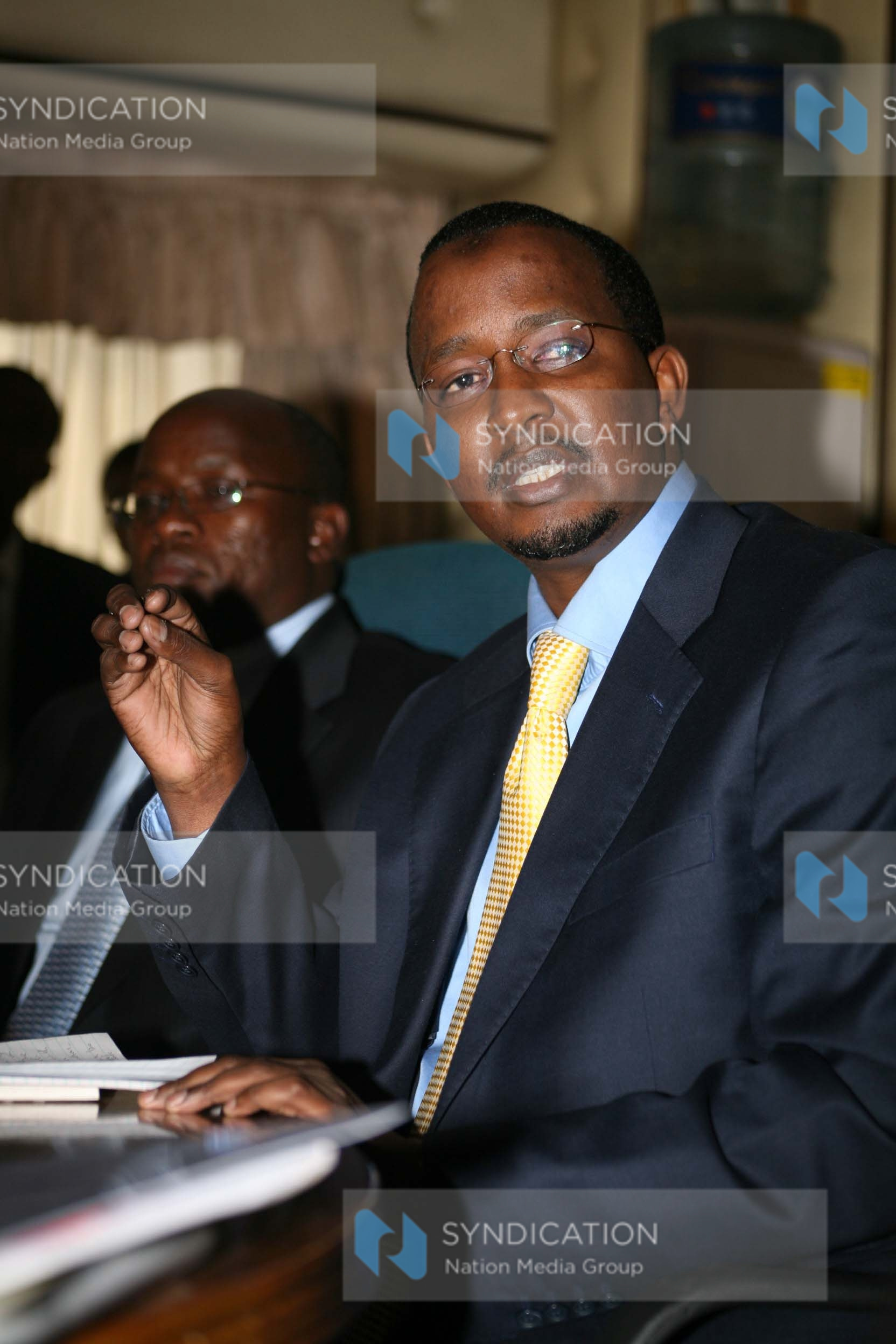 Mr. Issack Ahmed Hassan gestures during a media briefing