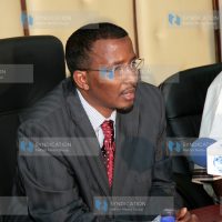 Issack Hassan (left) during a press conference