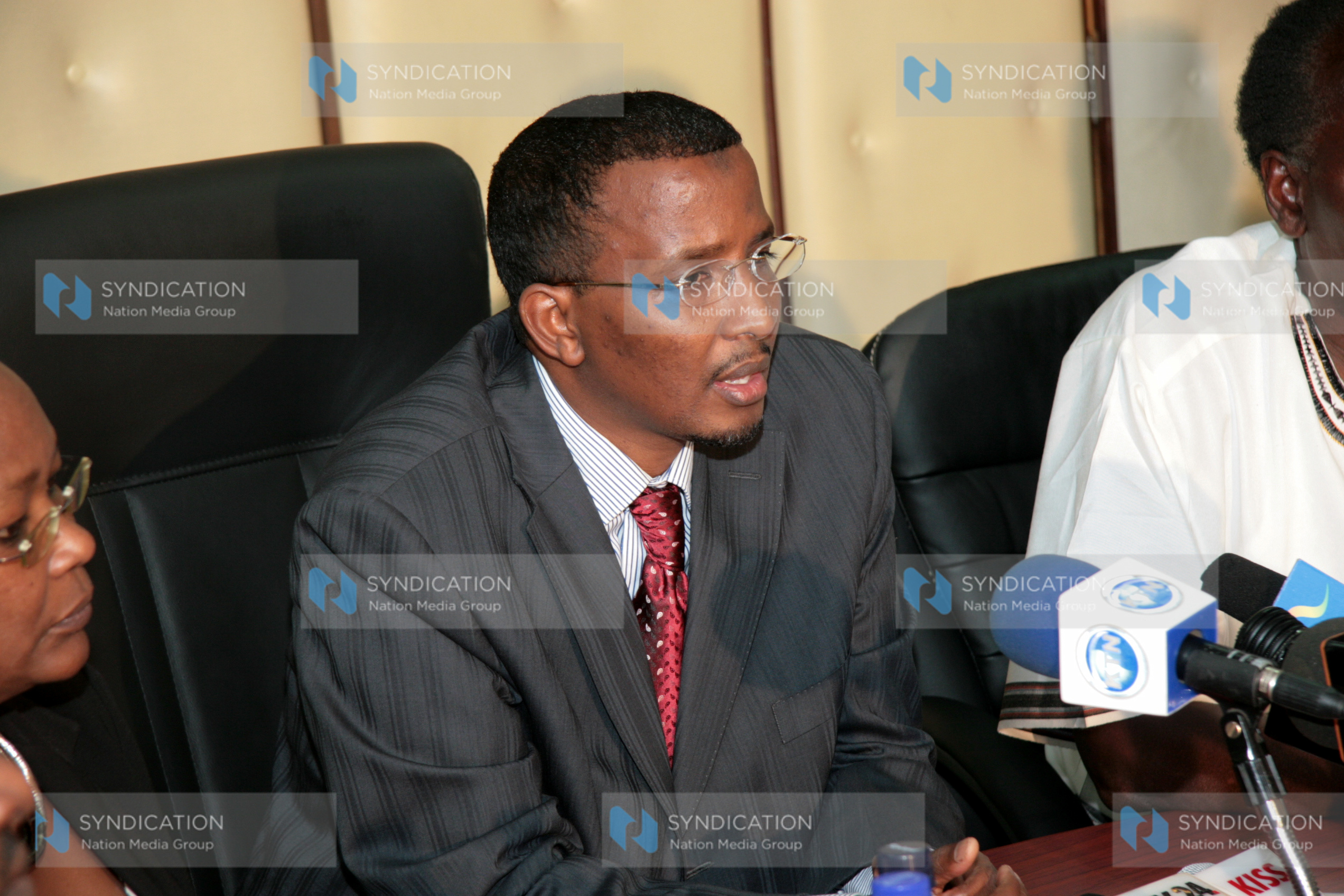 Issack Hassan (left) during a press conference