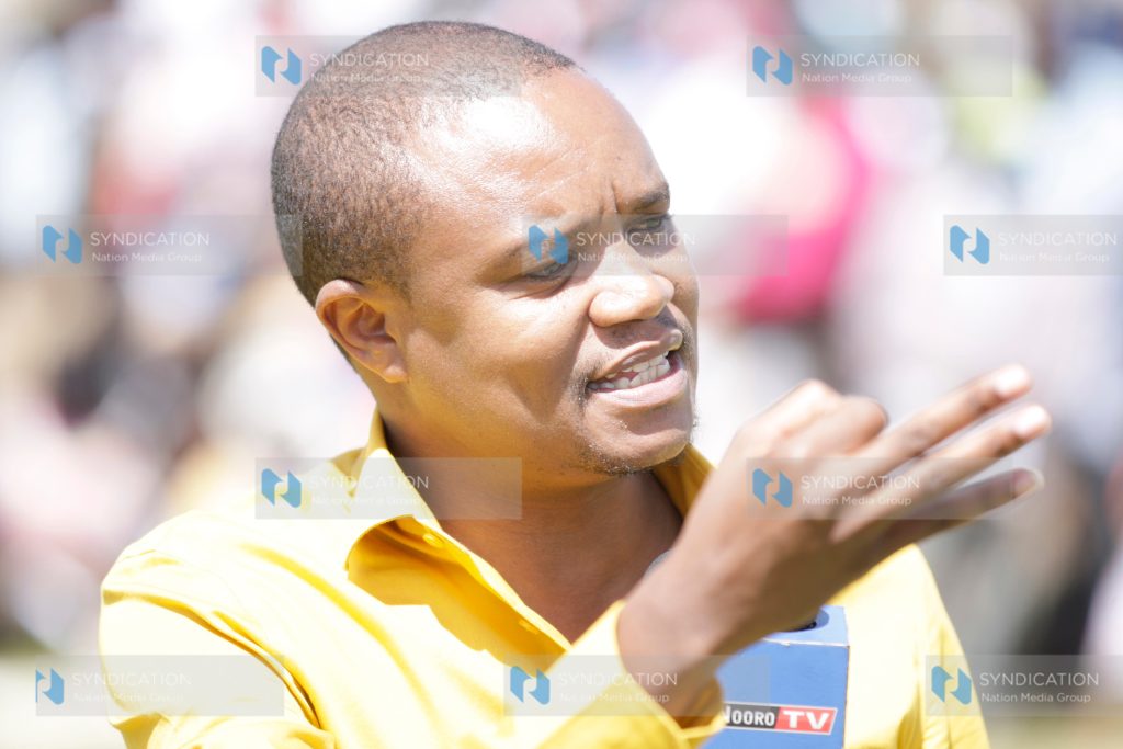 Molo MP Kuria Kimani addresses members of the public during the application of bursary forms