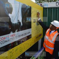 Industrialization CS Adan Mohamed signs a safety charter wall