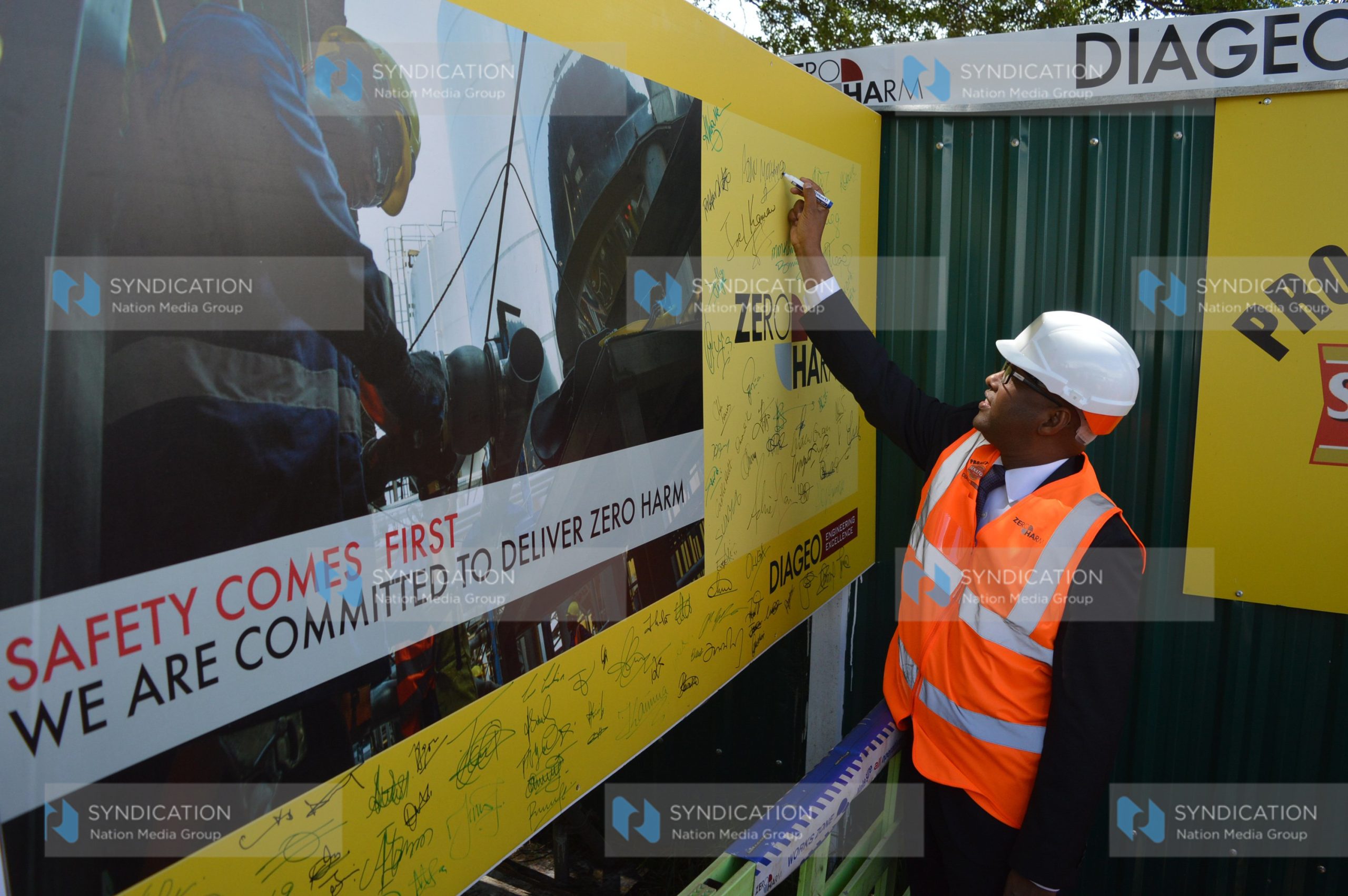 Industrialization CS Adan Mohamed signs a safety charter wall