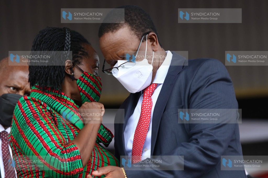 Interior Principal Secretary Karanja Kibicho chats with Narc Kenya leader Martha Karua