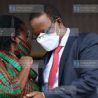 Interior Principal Secretary Karanja Kibicho chats with Narc Kenya leader Martha Karua