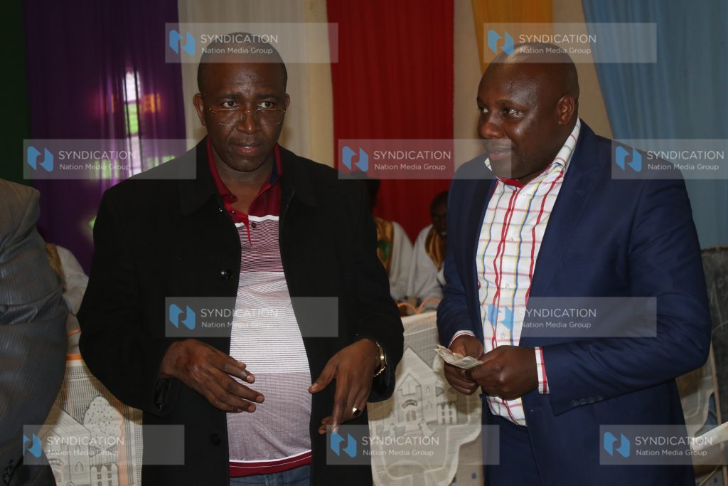 Igembe South MP Mithika Linturi (left) chats with Pastor Edwin Mugambi