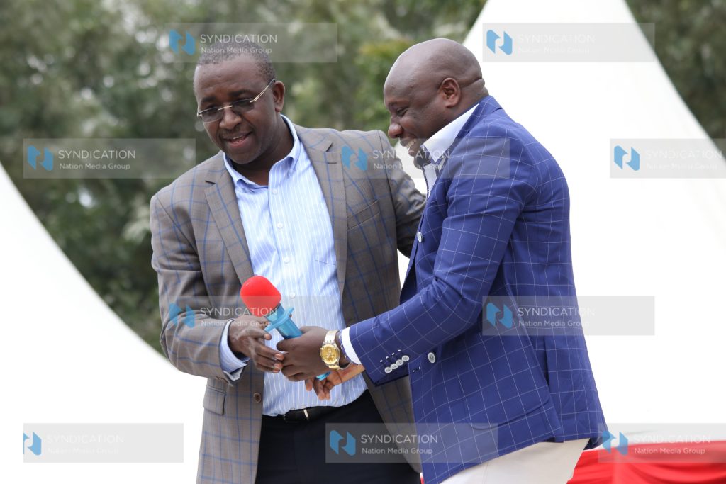 Igembe South MP Mithika Linturi is welcomed to the dais by Pastor Edwin Mugambi