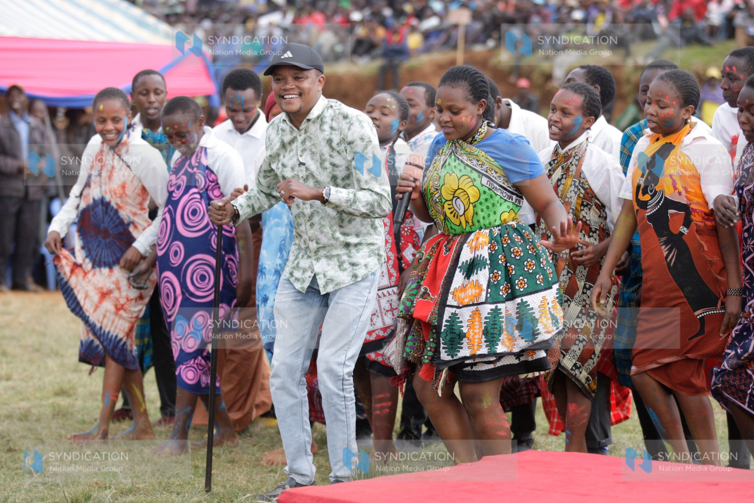 Molo MP Kuria Kimani engages in a jig with students