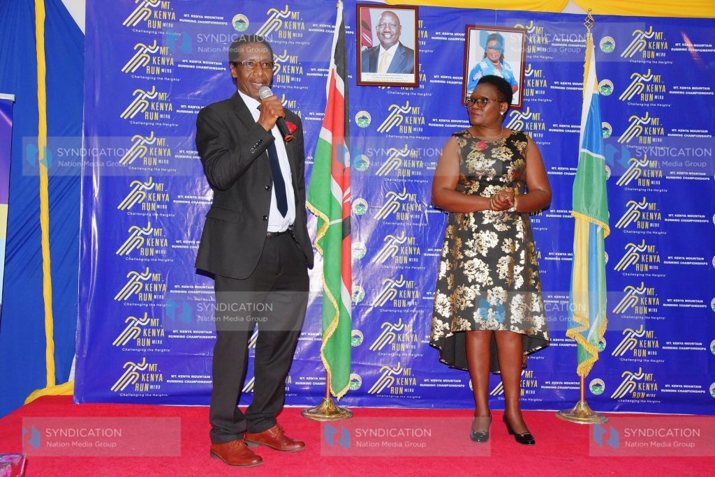 Kenya Methodist University Vice Chancellor David Gichoya presents a donation to Governor Kawira Mwangaza