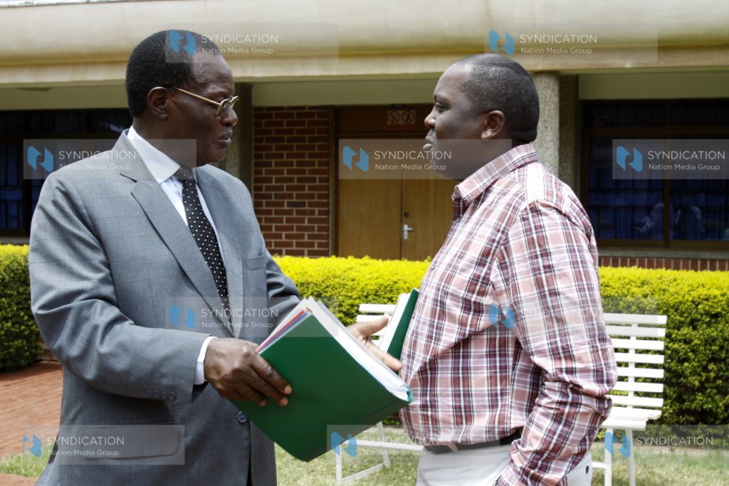 Minister for Roads and Public Works Dr Chris Obure with Mugo Kibati of the Vision 2030