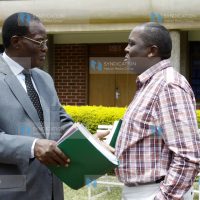 Minister for Roads and Public Works Dr Chris Obure with Mugo Kibati of the Vision 2030