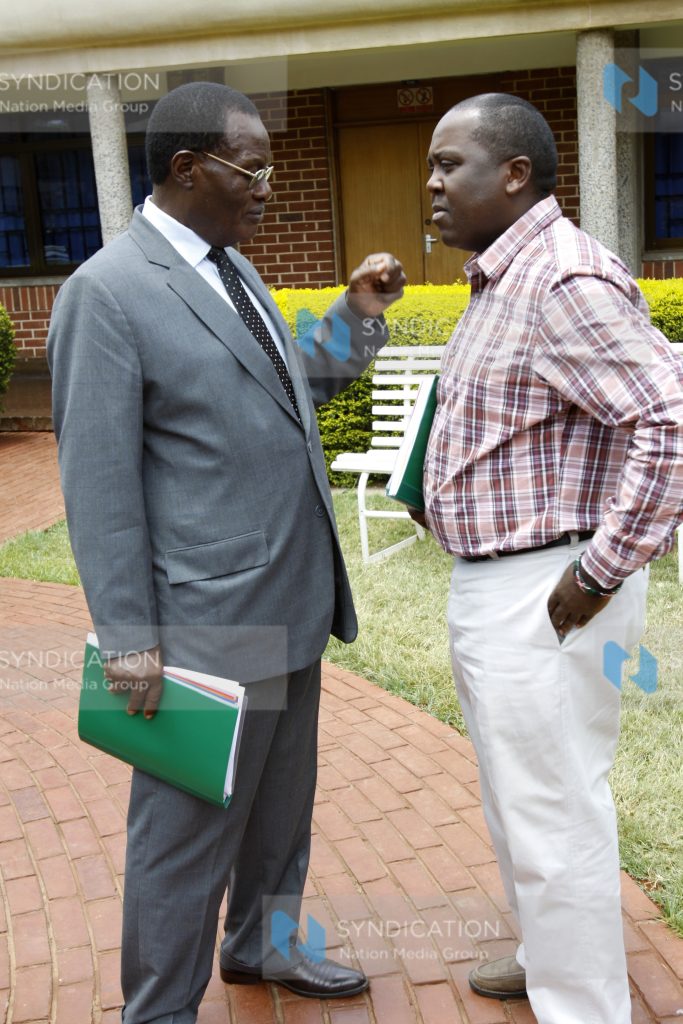 Minister for Roads and Public Works Dr Chris Obure with Mugo Kibati of the Vision 2030