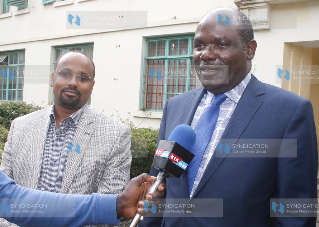 IEBC) chairman Wafula Chebukati with his Commissioner Boya Molu