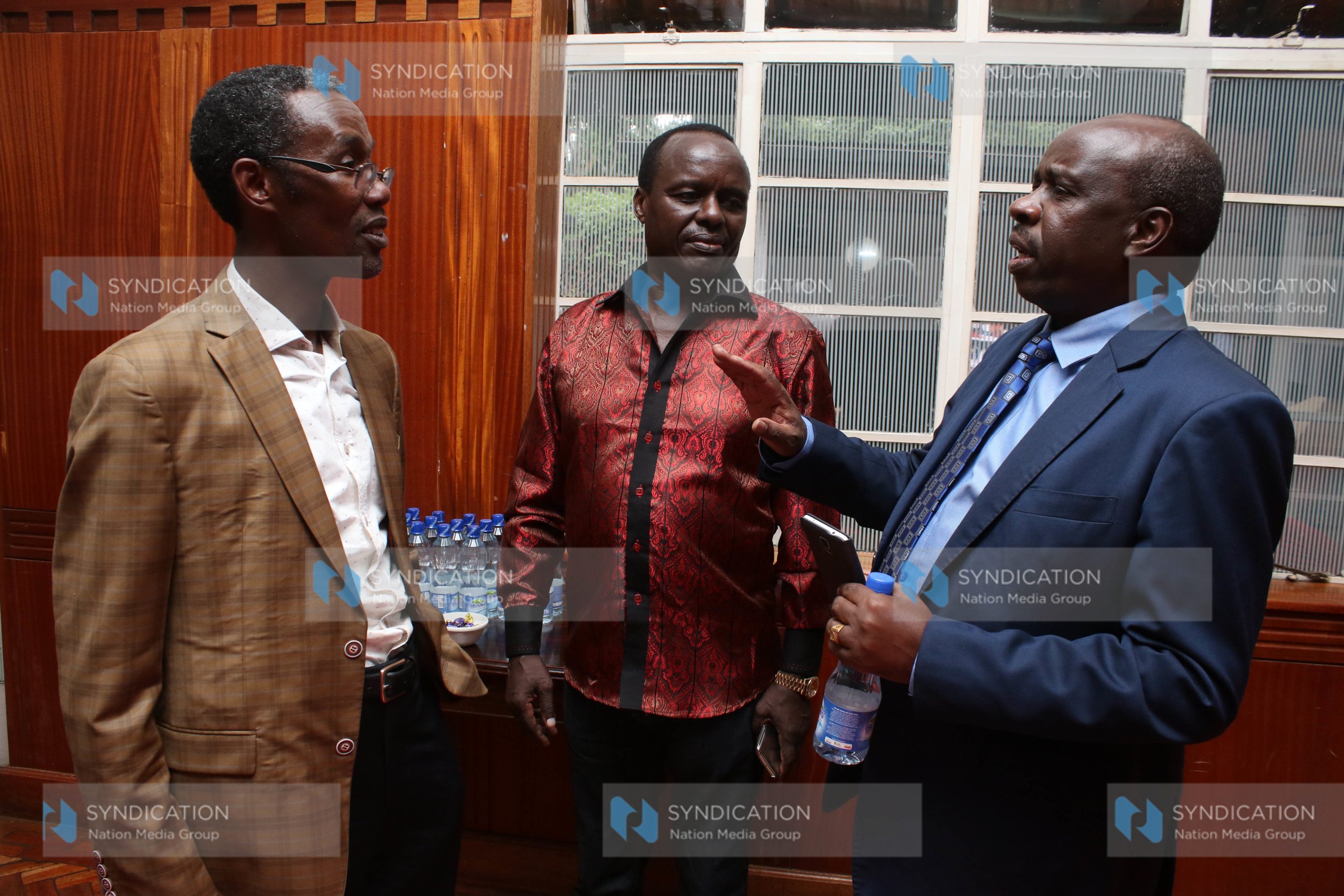 NACADA Chairman John Mututho chats with Embu Senator Lenny Kivuti and Kangema MP Tirus Ngahu