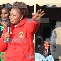 Rahab Mukami, centre, addresses residents of Embaringo village