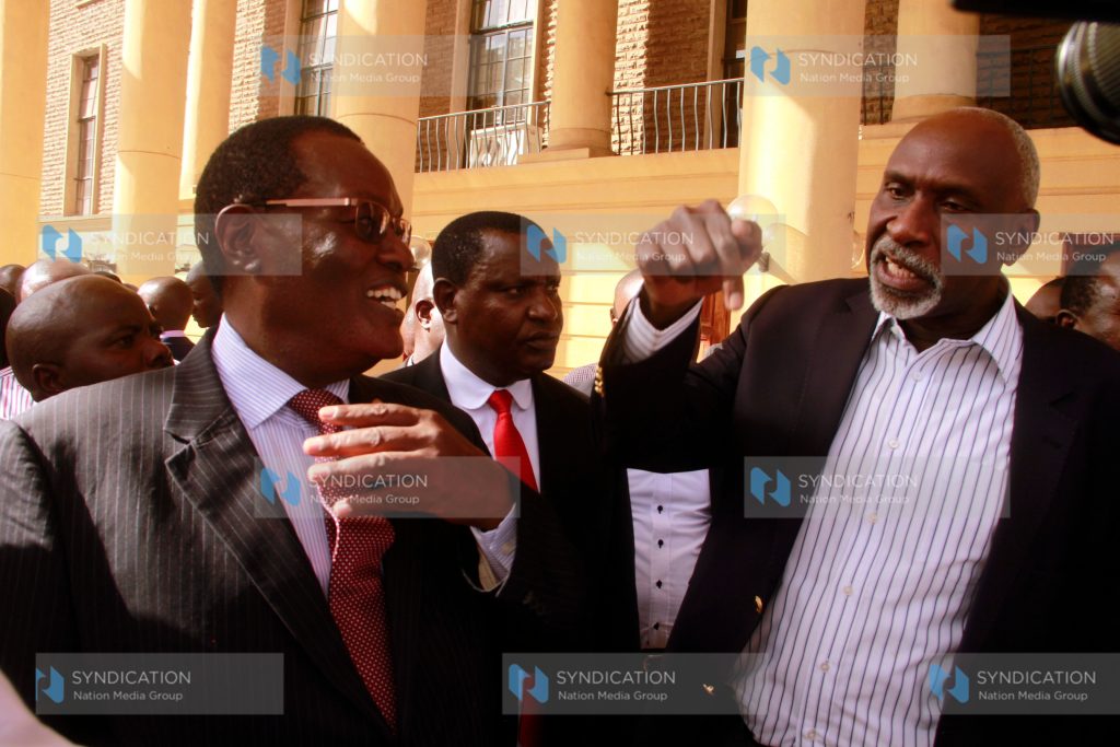 Kisii County Jubilee party governorship aspirant Chris Obure talking with Kisii County Senatorial Aspirant Charles Nyachae