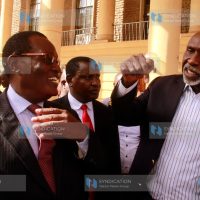 Kisii County Jubilee party governorship aspirant Chris Obure talking with Kisii County Senatorial Aspirant Charles Nyachae