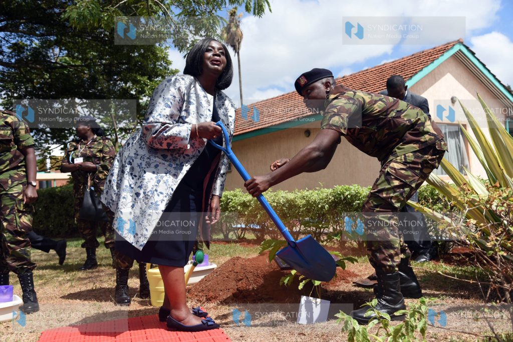 Defence Cabinet Secretary Raychelle Omamo prepares to plant a tree