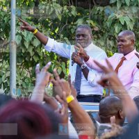 Nairobi City County Governor Johnson Sakaja (left), flanked by County Assembly Speaker Kennedy Ng’ondi, addresses supporter