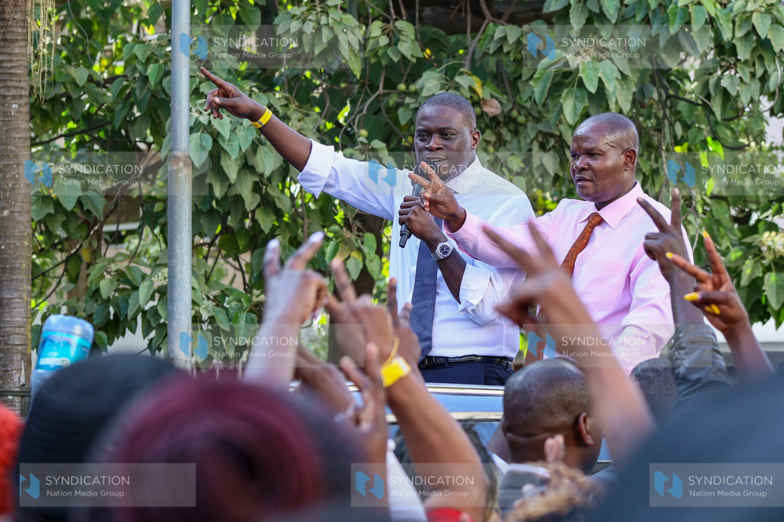 Nairobi City County Governor Johnson Sakaja (left), flanked by County Assembly Speaker Kennedy Ng’ondi, addresses supporter