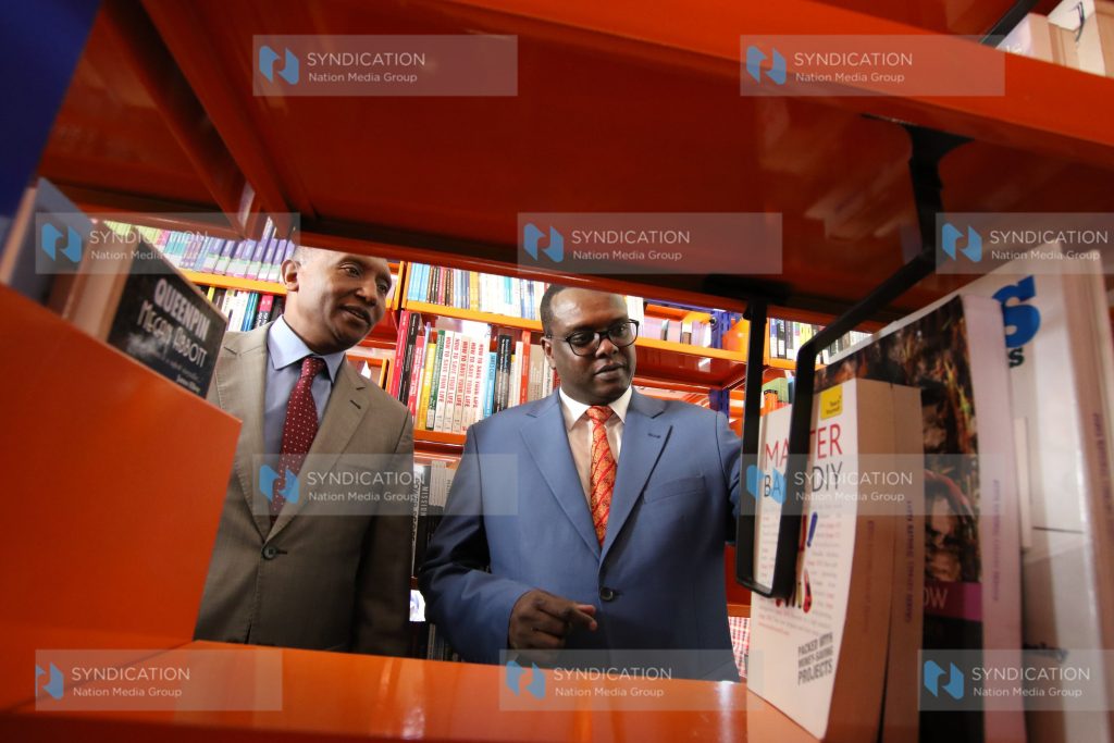 Sports CS Hassan Wario and Kenya National Library Service CEO Richard Atuti