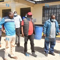 Meru Senator Mithika Linturi is escorted into a police vehicle