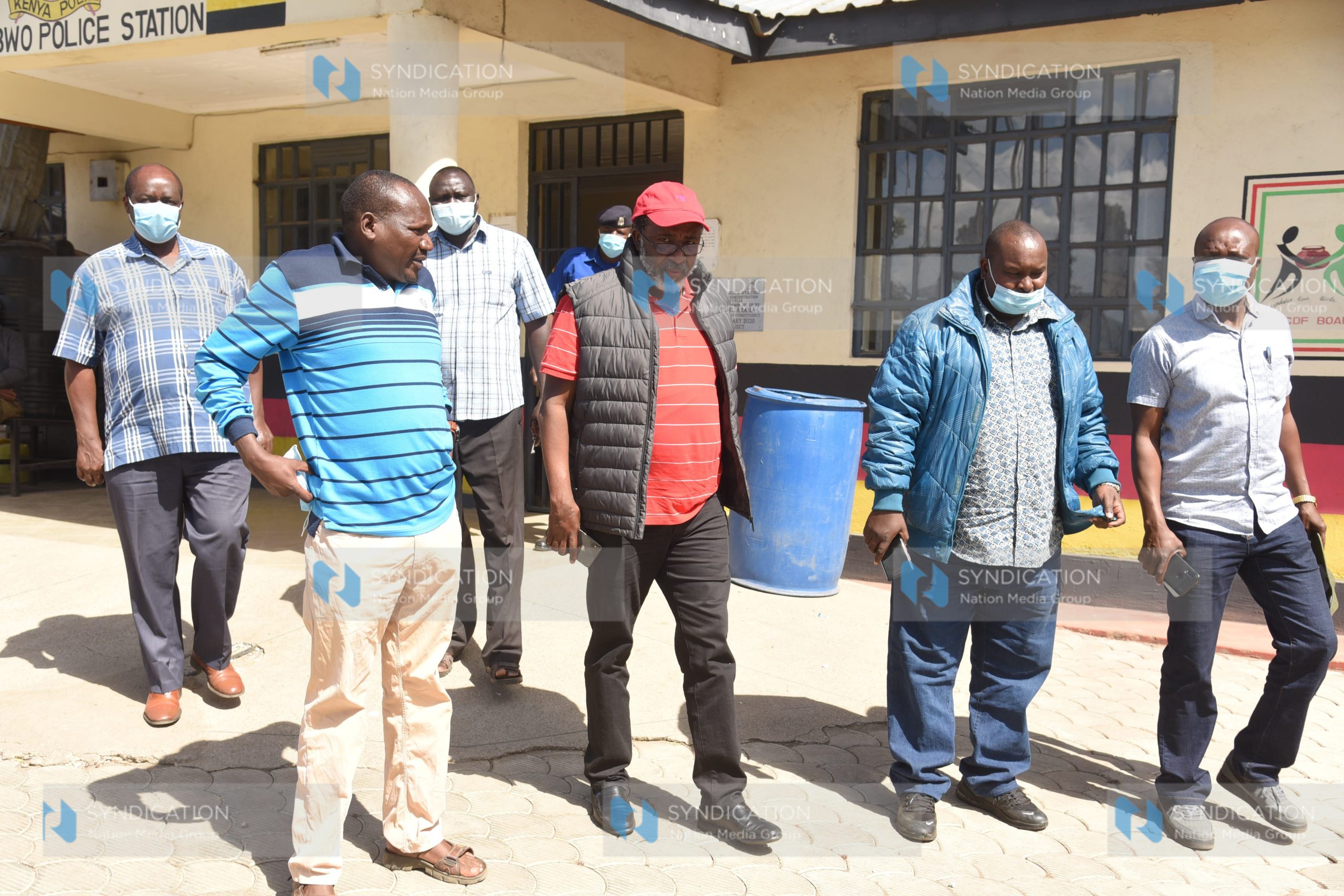 Meru Senator Mithika Linturi is escorted into a police vehicle