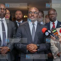 Principal Secretary for the State Department for Internal Security and National Administration, Dr Raymond Omollo (centre), addresses the media