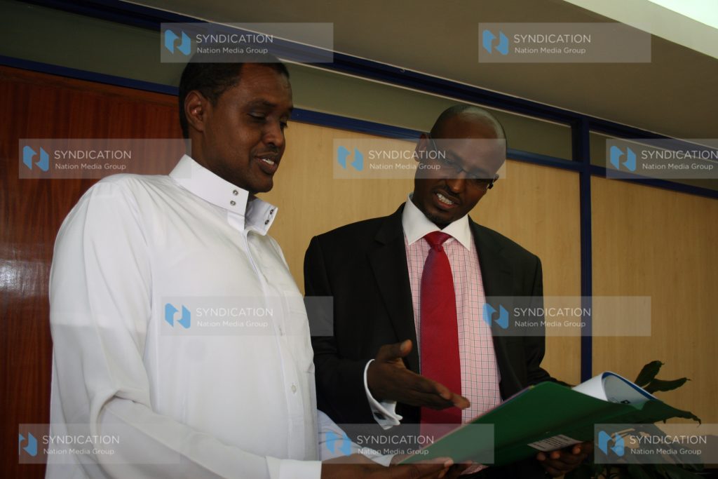 Wajir Governor Ahmed Abdullahi (Right) speaks with National Social Security Fund (NSSF) Board of Trustees chairman Adan Mohamed