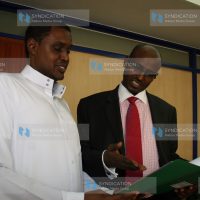 Wajir Governor Ahmed Abdullahi (Right) speaks with National Social Security Fund (NSSF) Board of Trustees chairman Adan Mohamed