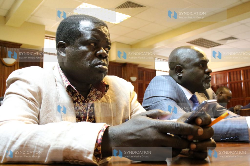 Activist Okiya Omtatah listens as High Court judges Anthony Mrima, Kanyi Kimondo and Arsenath Ongeri gave their ruling