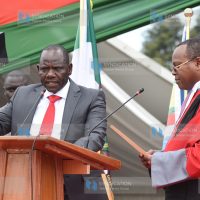 Uasin Gishu County Governor Jonathan Bii Chelilim (left), during the Swearing-in ceremony