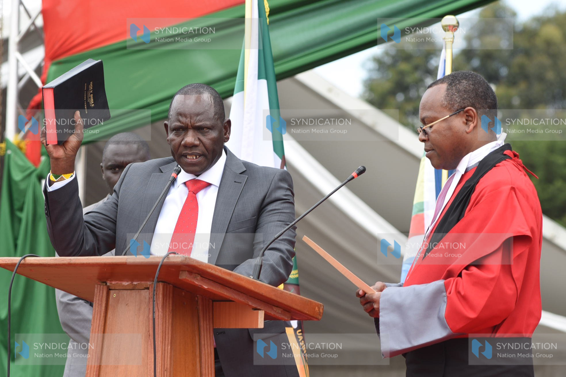 Uasin Gishu County Governor Jonathan Bii Chelilim (left), during the Swearing-in ceremony