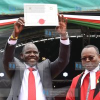 Uasin Gishu County Governor Jonathan Bii Chelilim (left), during his swearing-in ceremony
