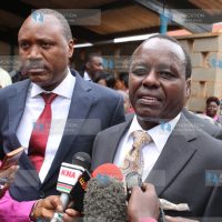 Senator Lenny Kivuti (right) address the press while flanked by his lawyer Wilfred Nyamu (in red tie) after leaving the Embu High court