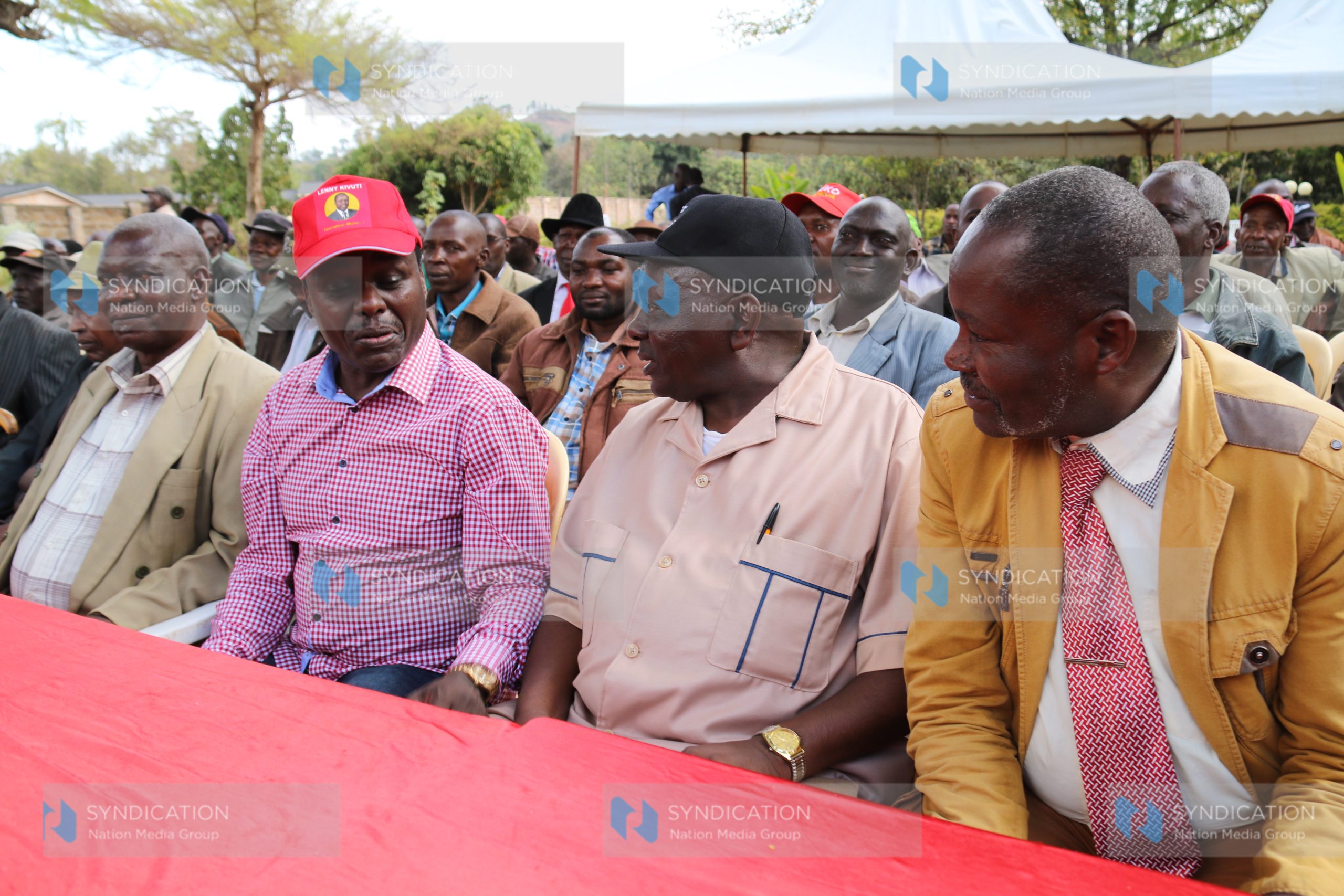 Embu Senator Lenny Kivuti chats with officials